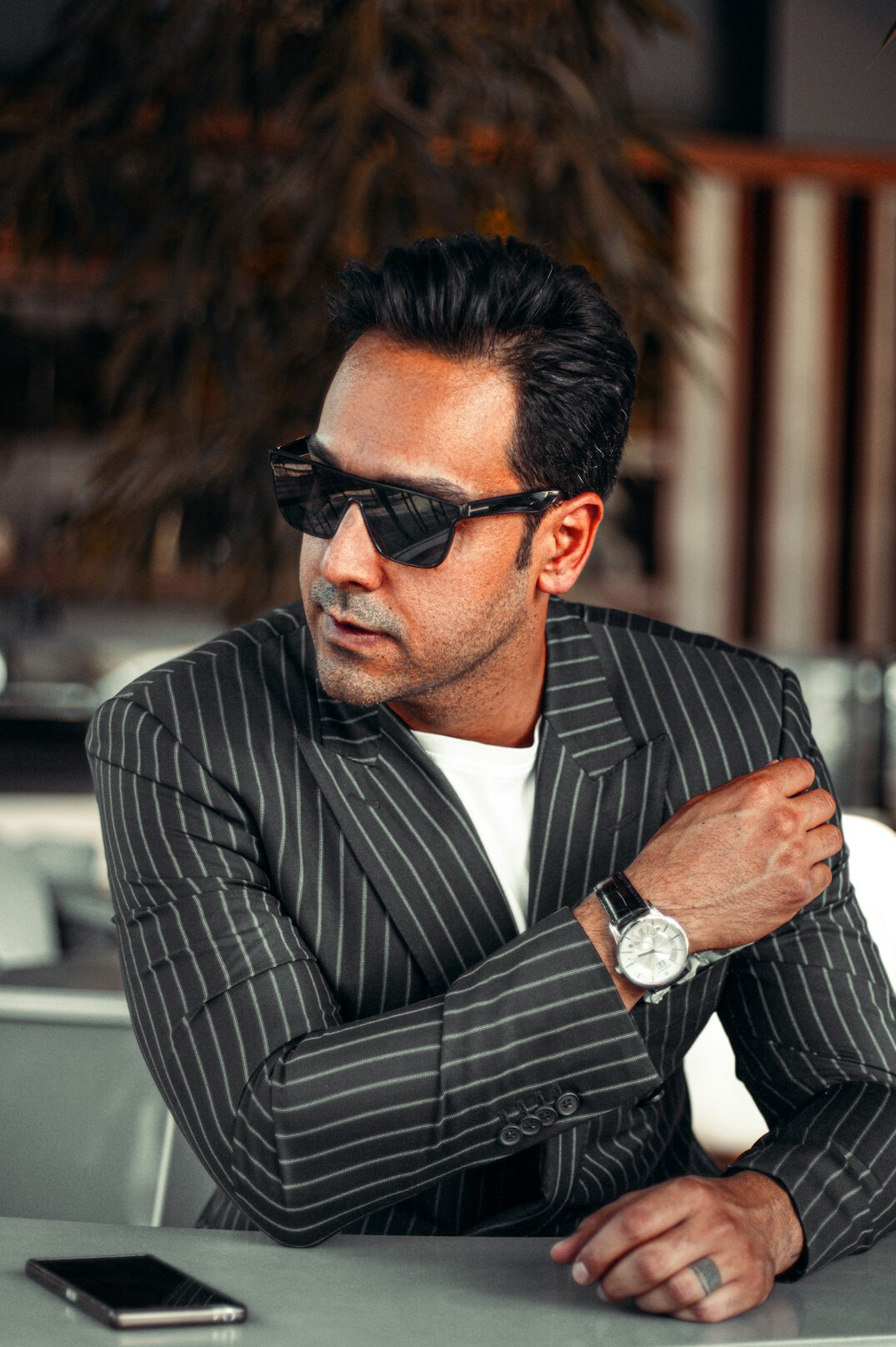 Portrait of a man in a suit with a confident expression
